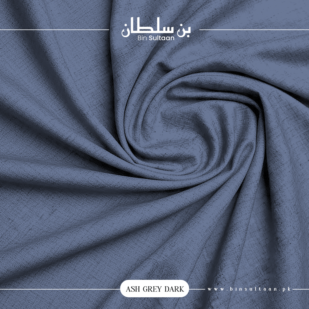 Close-up of dark blue fabric with 'Bin Sultaan' branding.