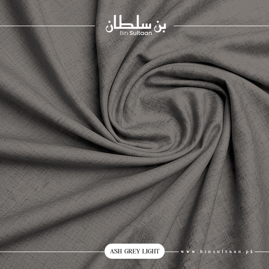 Close-up of ash grey fabric with 'Bin Sultaan' branding.